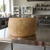 A wheel of authentic parmesan cheese imported from Italy.